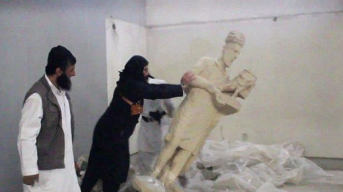 Isis fighters destroy ancient artefacts at Mosul museum