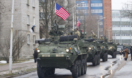 U.S. military vehicles paraded 300 yards from the Russian border